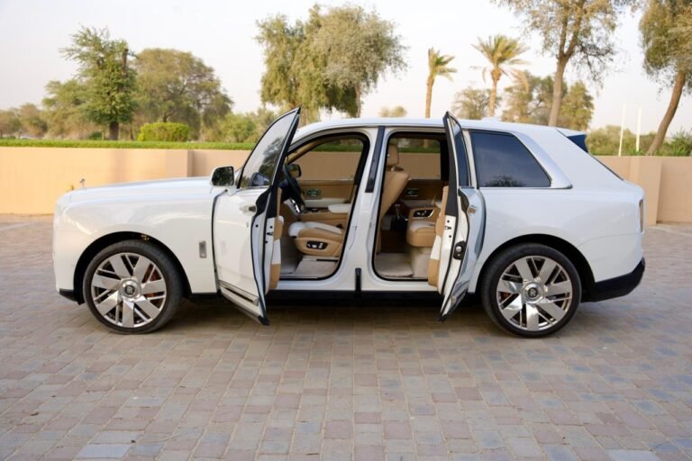 Rolls-Royce Cullinan coach doors open — side profile